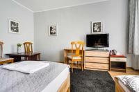 Łóżko lub łóżka w pokoju w obiekcie Hotel Sowa
