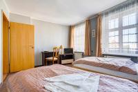 Łóżko lub łóżka w pokoju w obiekcie Hotel Sowa