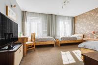 Łóżko lub łóżka w pokoju w obiekcie Hotel Sowa