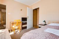 Łóżko lub łóżka w pokoju w obiekcie Hotel Sowa
