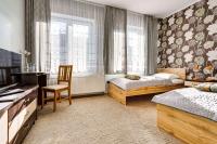 Łóżko lub łóżka w pokoju w obiekcie Hotel Sowa