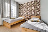 Łóżko lub łóżka w pokoju w obiekcie Hotel Sowa