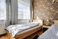 Łóżko lub łóżka w pokoju w obiekcie Hotel Sowa