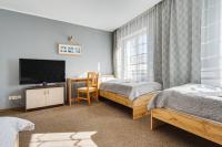 Łóżko lub łóżka w pokoju w obiekcie Hotel Sowa