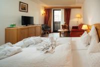 Łóżko lub łóżka w pokoju w obiekcie Hotel Garni Alpenruh-Micheluzzi
