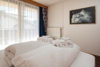 Łóżko lub łóżka w pokoju w obiekcie Hotel Garni Alpenruh-Micheluzzi
