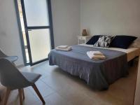 A bed or beds in a room at Roses Casc Antic S L Sabater 1