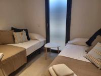 A bed or beds in a room at Roses Casc Antic S L Sabater 1