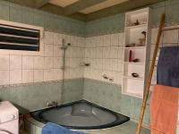 a bathroom with a bath tub in a room at Le Dodo Salé in Étang-Salé