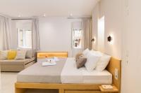 A bed or beds in a room at Magnolia Corfu Suite