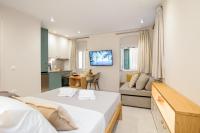 A television and/or entertainment centre at Magnolia Corfu Suite