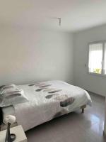 Posteľ alebo postele v izbe v ubytovaní Maison quetigny