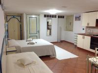 A bed or beds in a room at Addisora Appartamenti