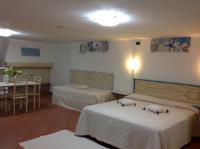 A bed or beds in a room at Addisora Appartamenti