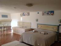 A bed or beds in a room at Addisora Appartamenti