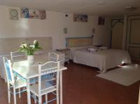 A bed or beds in a room at Addisora Appartamenti