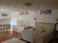 A bed or beds in a room at Addisora Appartamenti