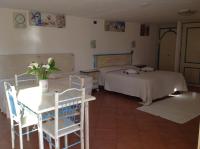 A bed or beds in a room at Addisora Appartamenti