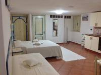 A bed or beds in a room at Addisora Appartamenti
