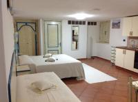 A bed or beds in a room at Addisora Appartamenti