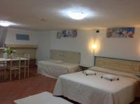 A bed or beds in a room at Addisora Appartamenti
