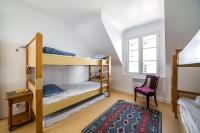 Łóżko lub łóżka w pokoju w obiekcie Petite maison bourg de La Trinite sur Mer - 4 à 6 couchages