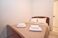 A bed or beds in a room at Mitropolis Old Town Apartment