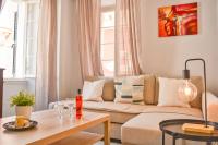 A seating area at Mitropolis Old Town Apartment