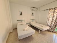 Postel nebo postele na pokoji v ubytování Apartamento Centro Benidorm Playa