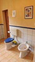 a bathroom with a toilet and a bidet at Gîte Périssée1 in Libaros