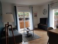 Posezení v ubytování 3 pièces avec terrasse arborée
