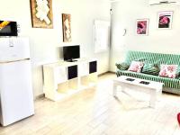 TV a/nebo společenská místnost v ubytování Urbanizacion el Palmar