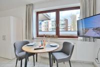 TV a/nebo společenská místnost v ubytování Strandburg Strandburg Appartement 1