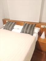 A bed or beds in a room at Piso acogedor con Parking