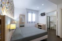 Posteľ alebo postele v izbe v ubytovaní Alaba Hotel