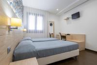 Posteľ alebo postele v izbe v ubytovaní Alaba Hotel