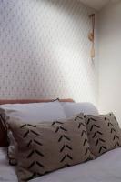 a bed with two pillows on it in a bedroom at Uzès médiévale l&#39;écrin d&#39;Amalia in Uzès