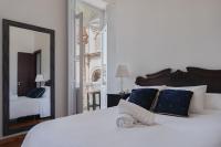 Postel nebo postele na pokoji v ubytování Santa Ana Suite & Rooms