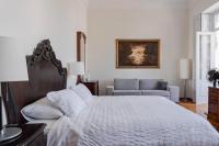 Postel nebo postele na pokoji v ubytování Santa Ana Suite & Rooms