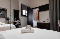 Postel nebo postele na pokoji v ubytování Santa Ana Suite & Rooms
