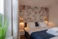 A bed or beds in a room at FACT Apartments