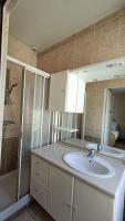 a bathroom with a sink and a shower at Le Bon Repos-ESA&#47;UCO avec jardin in Angers