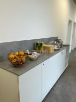 A kitchen or kitchenette at City Rooms Amstetten
