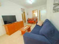 Televízia a/alebo spoločenská miestnosť v ubytovaní ACV - Playa Coral I-2ª linea planta 3 norte