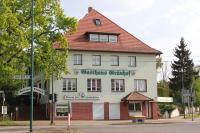 a large white building with a red roof at Gasthaus &amp; Hotel Grünhof in Frankfurt Oder