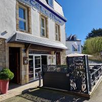 a building with a gate in front of it at Hotel Le Marin in Auray