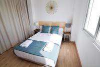 Posteľ alebo postele v izbe v ubytovaní Letmalaga Malasaña City Views Superior Apartment