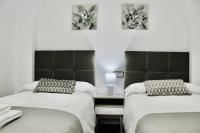 Posteľ alebo postele v izbe v ubytovaní Apartamento de 3 dorm en pleno centro de Nerja