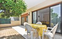 a dining table and chairs on a patio at 1 Bedroom Awesome Apartment In Le Cannet in Le Cannet