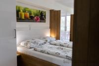 Posteľ alebo postele v izbe v ubytovaní Tisza Gyöngye Apartmanok